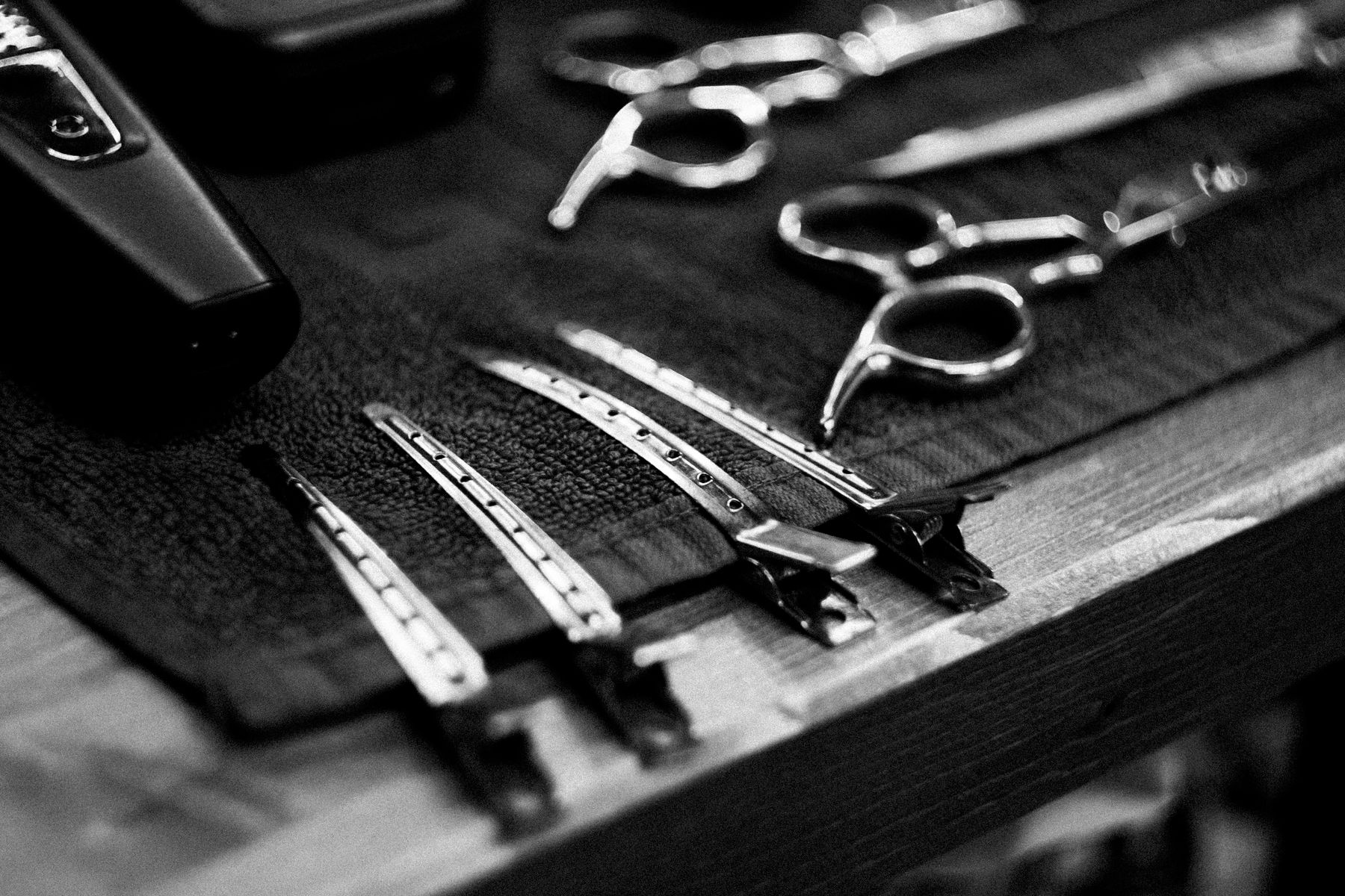 Barber tools arranged on a towel, illustrative stock